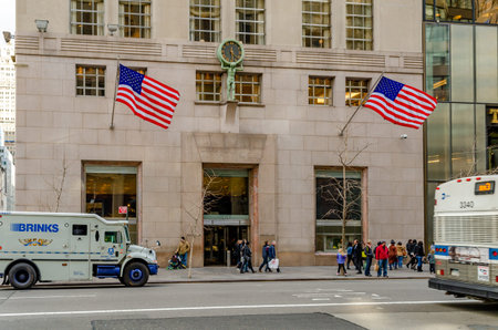 Tiffany & Co Store Building Entrance with People walking in front at Fifth Avenue, American Flags...