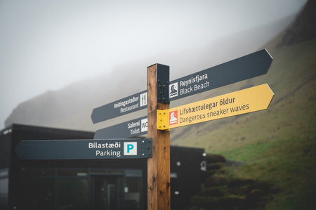 Way sign at Black Sand Beach Reynisfjara, Iceland during foggy weatheの写真素材