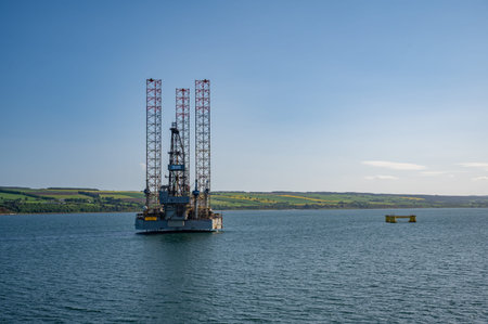 Industrial ship offshore wind turbine platform at the sea in the evening, Invergordon, Scotland