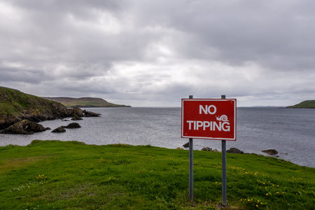 No Tipping Sign at the coast of Shetland Island during cloudy day, Scotland
