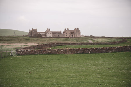Skaill House at Orkney Island, with old stone wall and meadow in front, wide angle shot, Kirkwall, Scotlandのeditorial素材