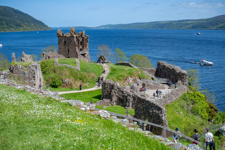 Urquhart Castle aerial view with lots of tourist walking around, Loch Ness, Scotlandのeditorial素材