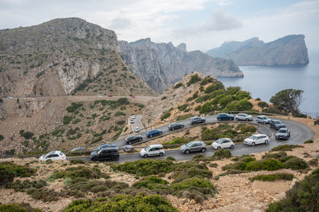 Traffic Jam at Cap Formentor, Majorca Spain, in front of Far de Formentor Lighthouse during rainy...