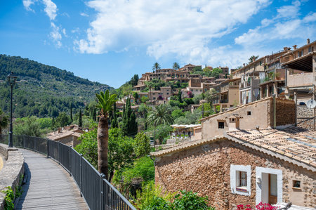Cityscape of Deia, Mallorca with buildings on a hill during great weather, Majorca