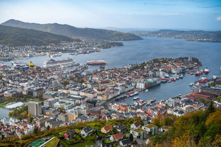 A panoramic view of Bergen city center and harbor, surrounded by hills and a serene body of water, Norwayの写真素材