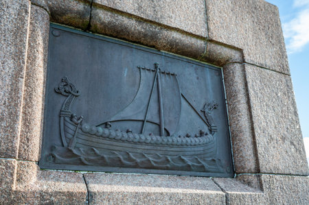 Haraldshaugen, Haugesund, bronze relief of a sailing ship with a serpent motif is mounted on a stone wall, Haugesund, Norwayの写真素材