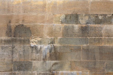 A photography of an old stone wall backgroundの写真素材