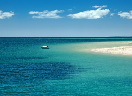 An image of a lonely boat at the beachの写真素材