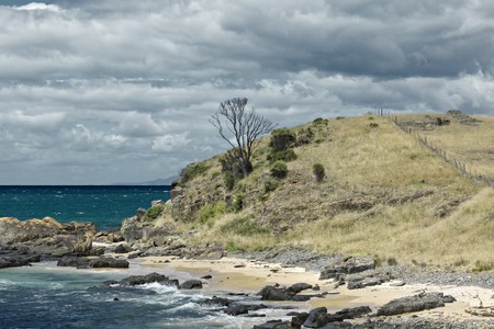 An image of the australian coast with rock, sand and the seaの写真素材