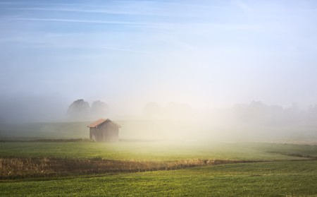 An image of a beautiful landscape with fog in bavaria germanyの写真素材