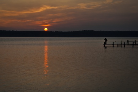 An image of a sunset photographer at the seaの写真素材