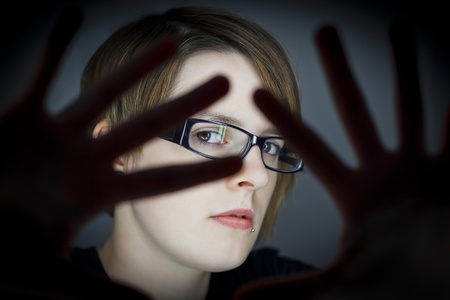 An image of a nice girl looks through fingersの写真素材