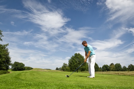An image of a young male golf playerの写真素材