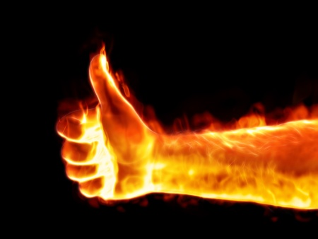 An image of a male thumb up on fireの写真素材