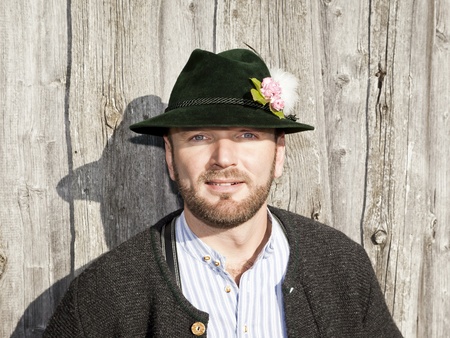 A traditional bavarian man in the autumn natureの写真素材