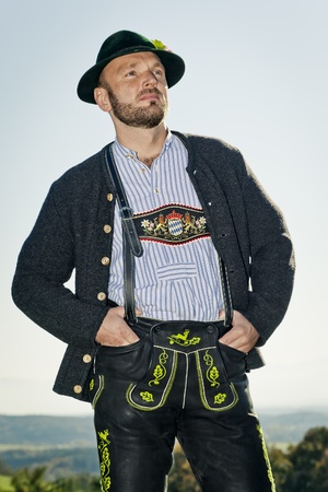 A traditional bavarian man in the autumn natureの写真素材