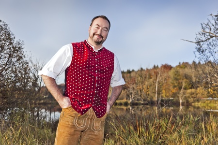A traditional bavarian man in the autumn natureの写真素材