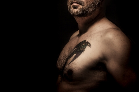 An image of a handsome man with a tattooの写真素材