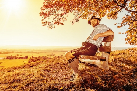 A traditional bavarian man in the autumn natureの写真素材