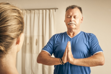 An image of some people doing yoga exercisesの写真素材
