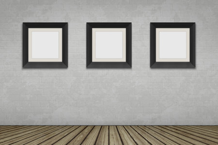 An empty room with three picture frames