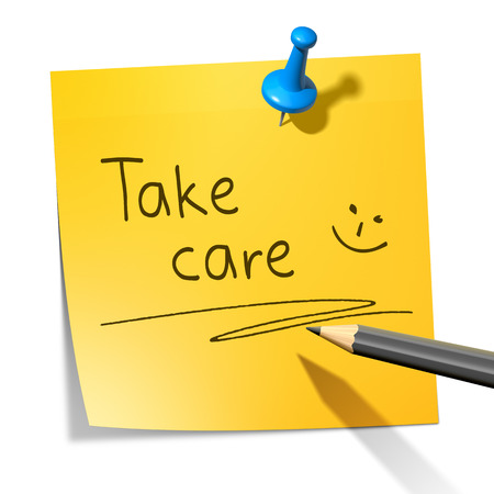 A sticky paper with the message take careの写真素材