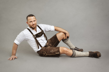 An image of a man in bavarian traditional lederhosenの写真素材