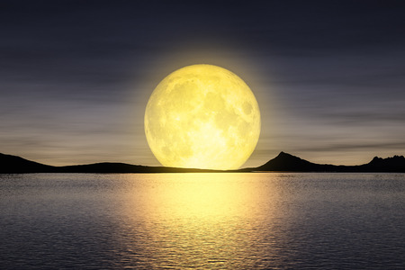 3d rendering of a moon rising over the seyの写真素材