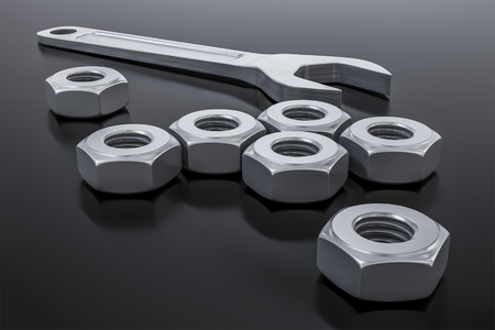 3d illustration of a hexagon nut with a wrenchの写真素材