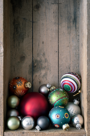 Christmas decoration glass balls in a wooden box backgroundの写真素材