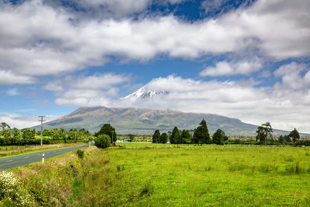An image of the volcano Taranaki covered in clouds, New Zealandの写真素材