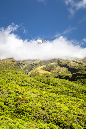 An image of the volcano Taranaki covered in clouds, New Zealandの写真素材