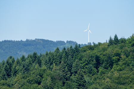 An image of a wind turbine in the forestの写真素材