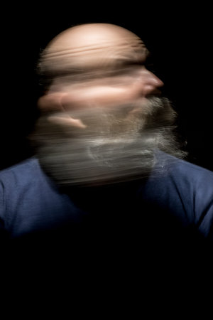An image of a bearded man motion blur portrait