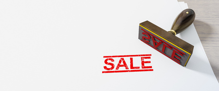 Red stamp sale on white paperの写真素材