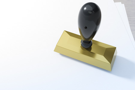 Metal stamp on white paperの写真素材