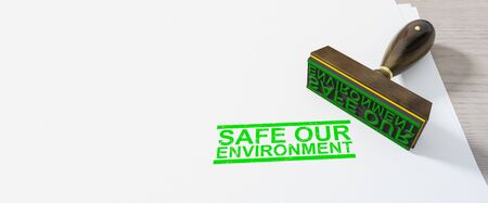 Green safe our environment stamp on white paperの写真素材