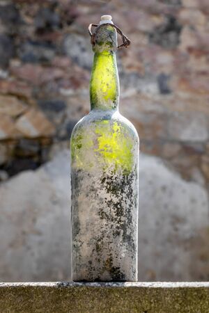 An image of a dirty old wine bottleの写真素材