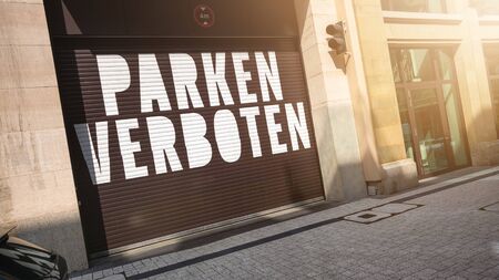An image of the text parking forbidden in german language on a garage doorの写真素材