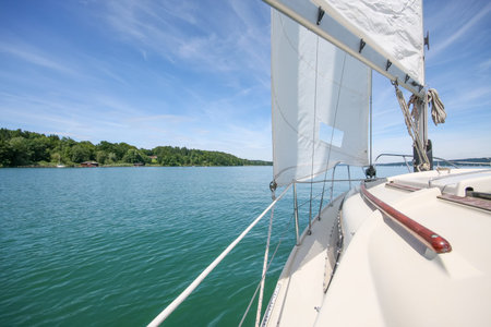 An image of a sailing boat at Starnberg Lake in Germanyの写真素材