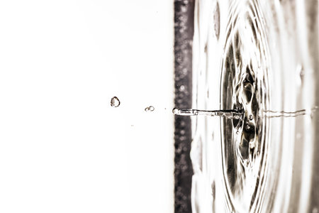 An image of a beautiful black water drop background tilt