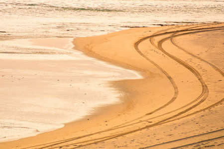 An image of tire tracks on the beachの写真素材