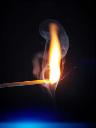 An image of a match flame dark backgroundの写真素材