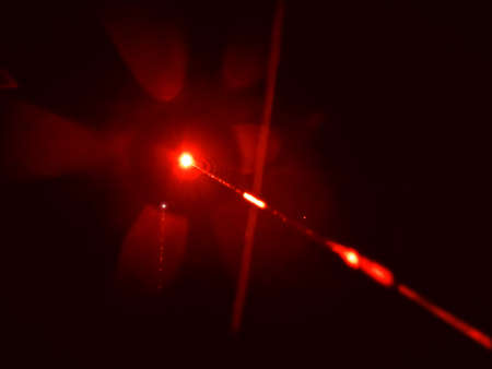 An image of a red laser beamの写真素材