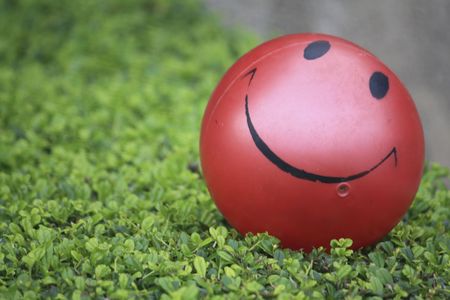 Red ball on greenの写真素材