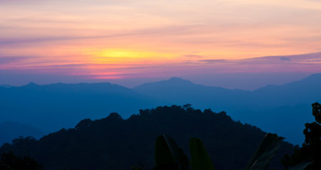 Sunset over mountains in Pechaburi,Thailandの写真素材