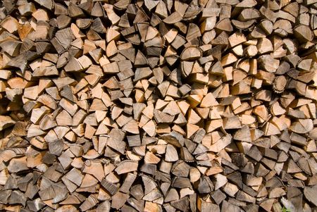 Stack of wood piled up to be used for heating.の写真素材