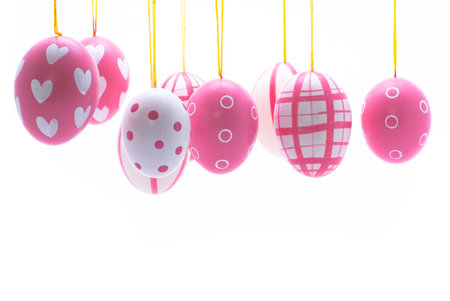 Differently painted easter eggs on white background.