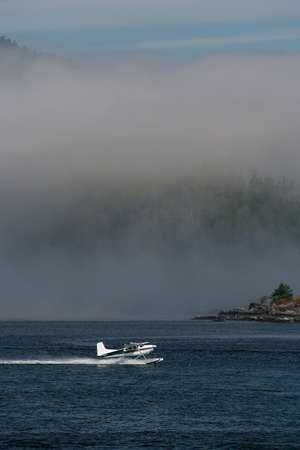 Float Plane Accelerates for Takeoff in Tofino on Vancouver Island in Canadaの写真素材
