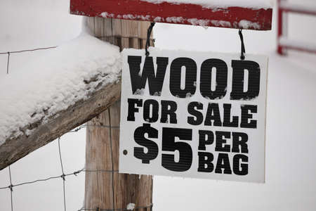 A Firewood for Sale Sign in a rural settingの写真素材